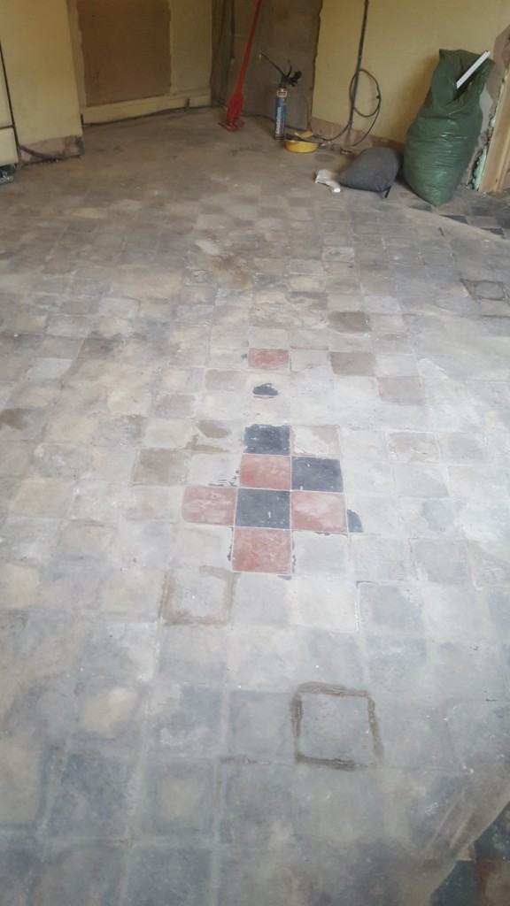 Red and Black Quarry Tiled Kitchen Floor Covered in Screed Before Cleaning in Mobberly