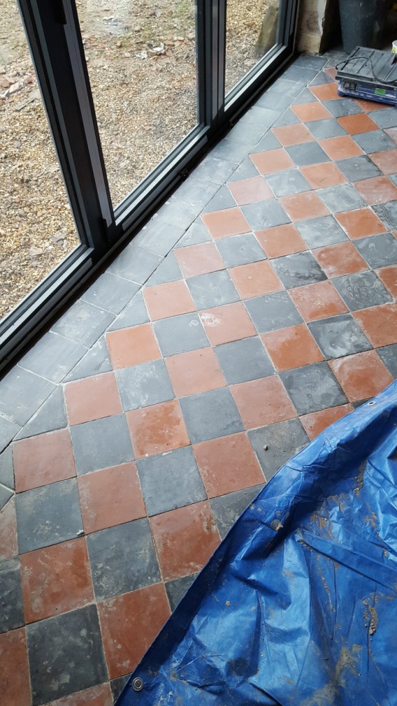 Red and Black Quarry Tiled Kitchen Floor Showing Repaired Tile Section in Mobberly